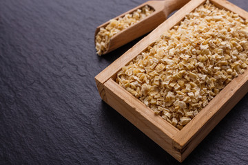 fragrant dried parsnip on a dark stone background