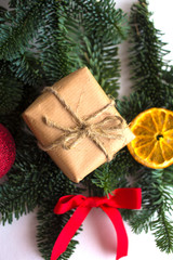 Christmas and New Year border design on the white background with fir tree and orange dry decoration and space for text
