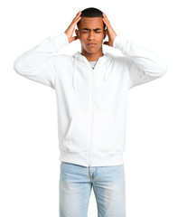 Dark-skinned young man with white sweatshirt unhappy and frustrated with something. Negative facial expression on isolated white background