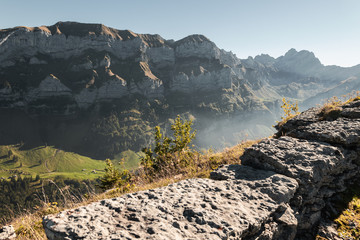 mountain range of Alpstein mountain massif in the evening fog