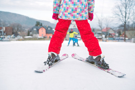 Little girl preparing to ski downhill