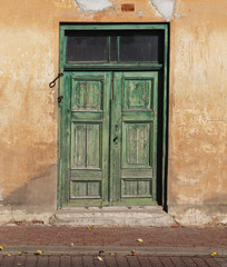 Wooden green door.