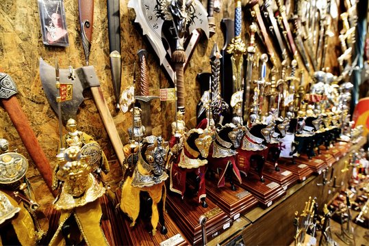TOLEDO - SPAIN / 08.10.2018: Toy knights with horses sold at souvenir shop in Toledo Old Town, Spain