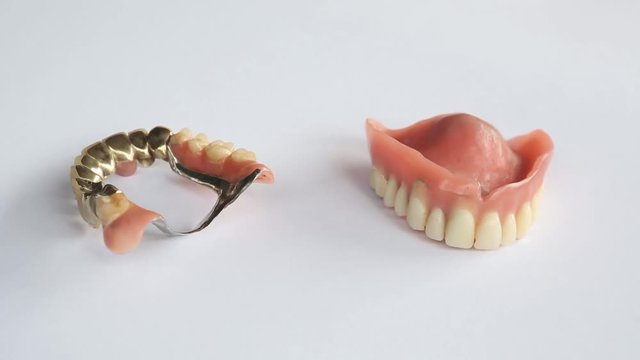 Dentures on a rotating white plate
