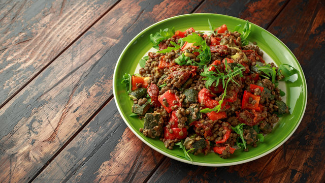 Lentil salad with roasted red pepper, zucchini and dry tomatoes, lemon. healthy food, vegetarian and vegan style