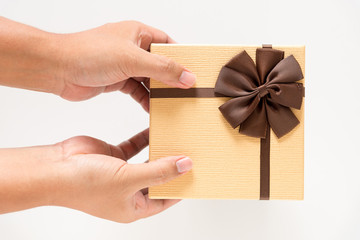 man hand giving brown gift box