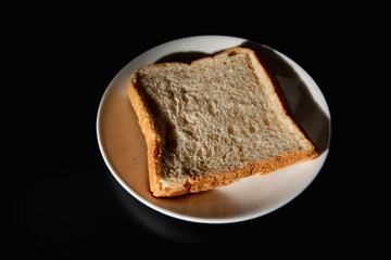 whole wheat bread on black background