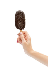 Woman's hand holding ice cream on stick. Isolated on white.