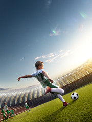 Fototapeta na wymiar children soccer player in action in stadium