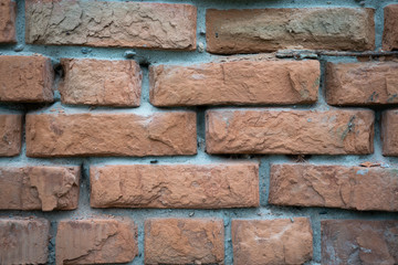 The surface of a brick wall for a close-up background.