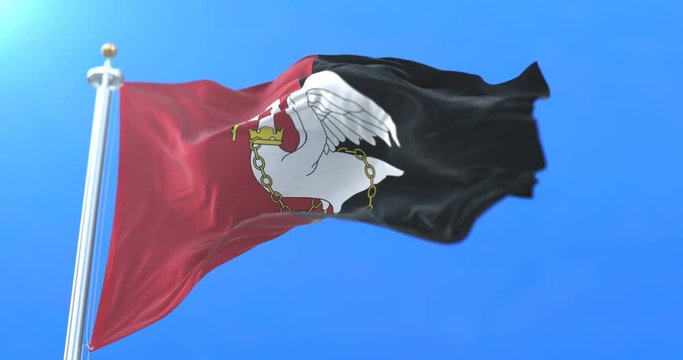 Flag of the english county of Buckinghamshire in the South East of England waving at wind with blue sky in slow. Loop