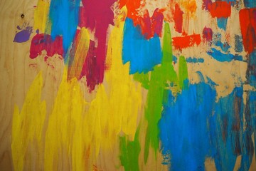 Wood texture painted with blue, red, green, purple paint. Blue painted wood. Painted wood background. Colorful wood wall