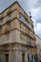 Fototapeta na wymiar Narrow streets and buildings in Valletta, Malta