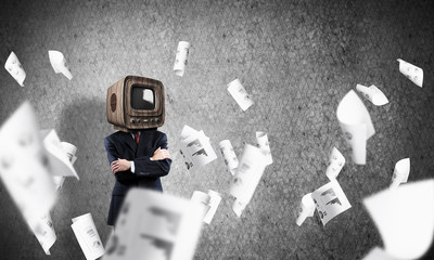 Businessman with old TV instead of head.