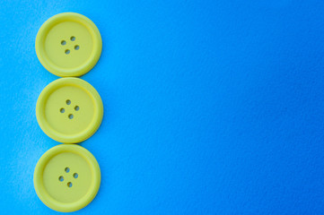 Three yellow buttons on a blue background.