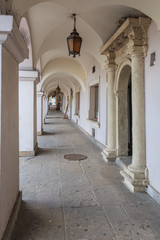 Zamosc,,arcades characteristic for  Renaissance  tenements at old town market  - obrazy, fototapety, plakaty
