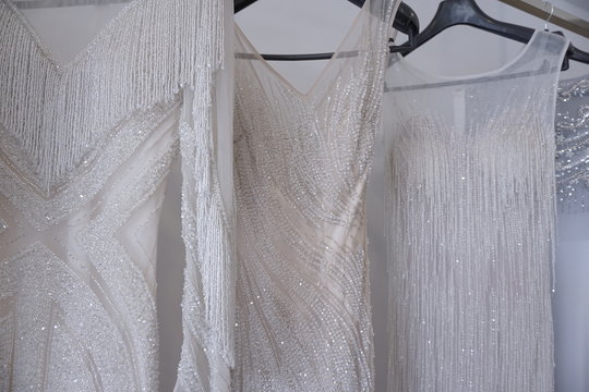 white wedding dress on a hanger