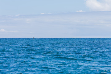 Fisherman in a small wooden boat