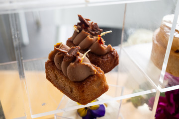 Small cake with hazelnut madeleine, gianduja chantilly and gianduja milk chocolate