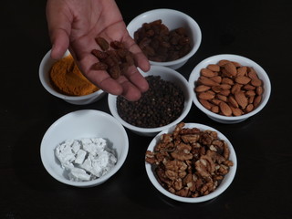 Turmeric, Kismish, Almonds, Badam, Akhrot, Walnuts, Chuna, Limestone, Haldi, Black Pepper, Kali Mirch, Wooden Background,