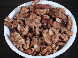 Dry fruits , walnuts akhrot against white background,Walnuts - Walnuts in black background, Walnuts On White Background, Akhrot in White Bowl on Wooden Background,
