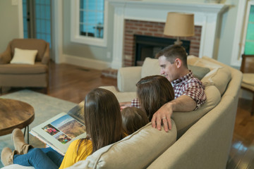 Mom Dad and Kids on the Couch for Family Time