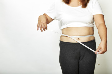 Fat woman with measure tape