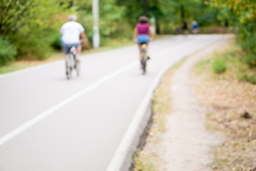 People on bikes out of focus