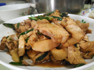 Close up of delicious brown color fried chicken with oyster sauce on white plate in Taiwan.Chinese home cuisine,Asian style meat cooking food.