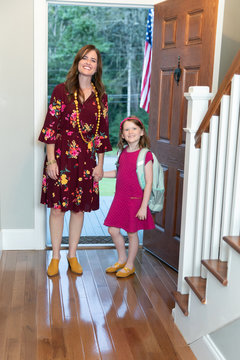 Mom And Daughter At Front Door On First Day Of School