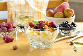 Cottage cheese with fresh berries and jam for breakfast