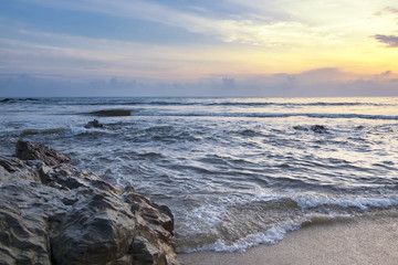 Travel and leisure concept, beautiful sea view scenery over stunning sunrise background.sunlight beam and soft wave hitting sandy beach