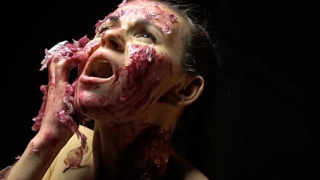 Brunette woman skinning her face