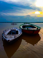 Sunrise upon boat at varanasi, india