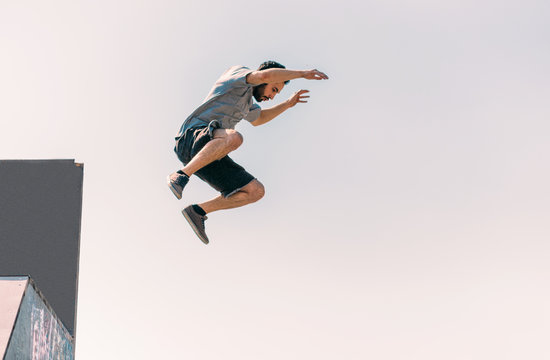 Free runner make parkour in the air