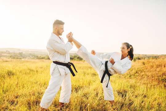 Female karate on training with male instructor