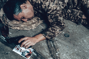 Soldier In Camouflage Is Sleeping In War Shelter.