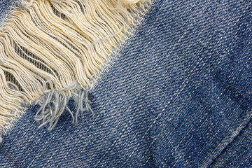 Jeans background. texture torn denim