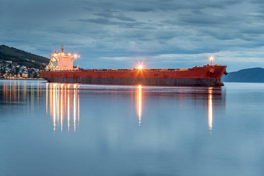 View Of A Cargo Ship Anchoring In A Port Of Narvik To Load Iron Ore, Norway