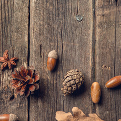 Autumn composition. Frame made of autumn dried leaves on dark wooden vintage background.