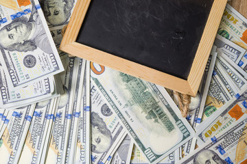 Business plan on financial income, dollar and business diagrams on financial reports with coins and blackboard. Work and profit