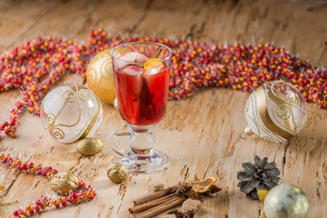 Mulled wine with nuts and spices. Selective focus.
