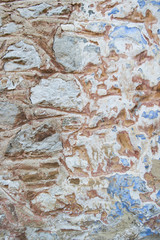 old Stone wall as a background or texture, old castle stone wall brown and blue