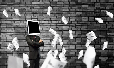 Businessman with monitor instead of head.