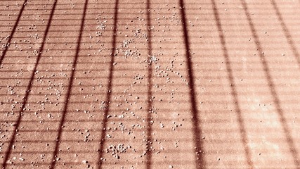 abstract geometric pattern with dark lines on pink background