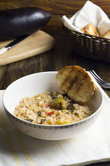 Risotto with vegetables, eggplant and peppers.