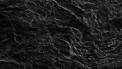 Fototapeta na wymiar Beautiful, textured surface of black Silesian slate close-up