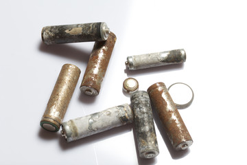Used finger-wound batteries covered with corrosion. Recycling.