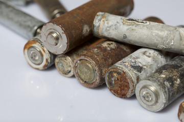 The fulfilled batteries of the different size covered with corrosion. Recycling.