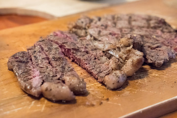 Medium rare meat on plate with sauce